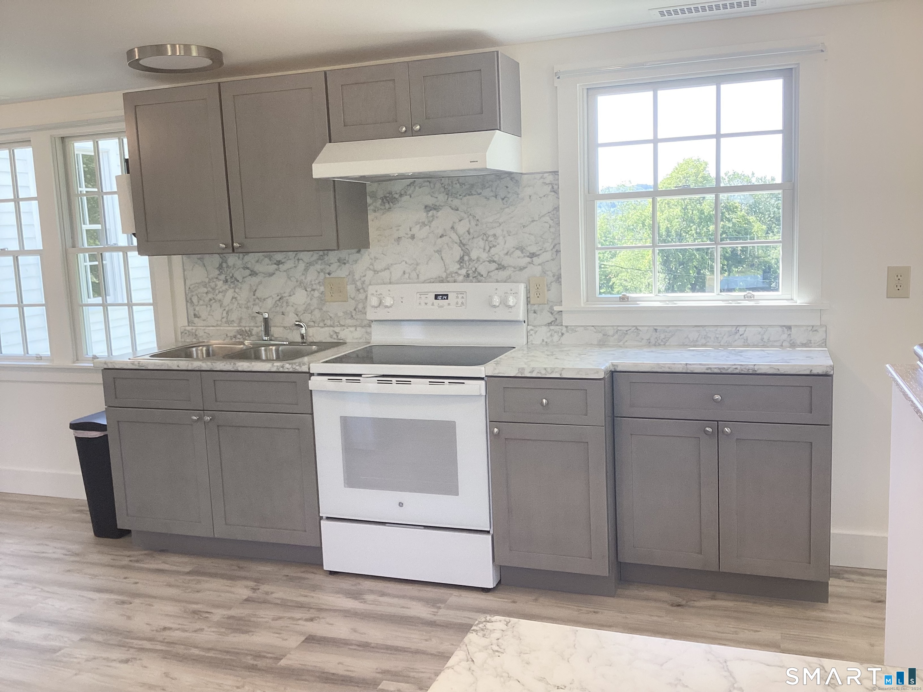 533 Weekeepeemee Road Woodbury, CT 06798 - Photo 14 of 17 a kitchen with cabinets appliances and a window