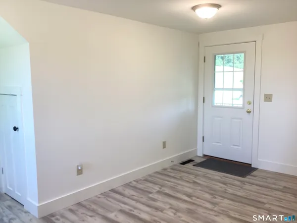 a view of a house with a small yard