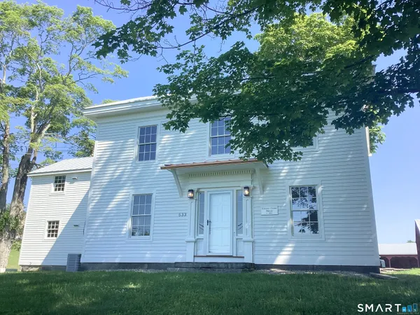 front view of a house with a yard