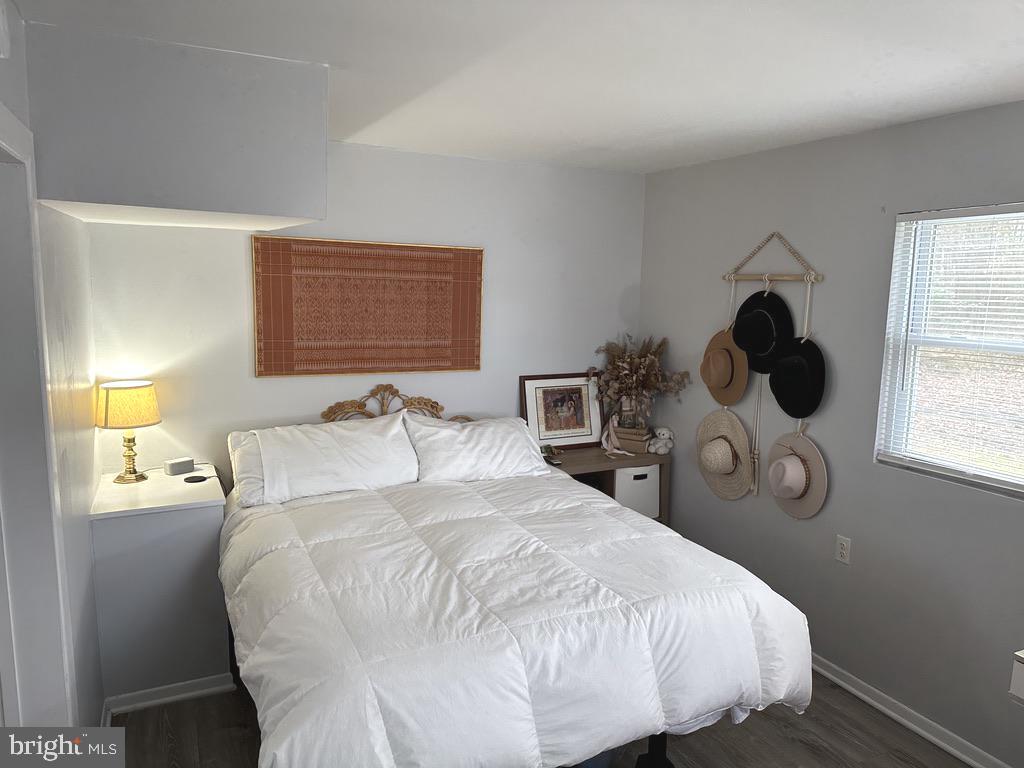 7703 Dover Road Glen Burnie, MD 21060 - Photo 11 of 25 a bedroom with a bed and window