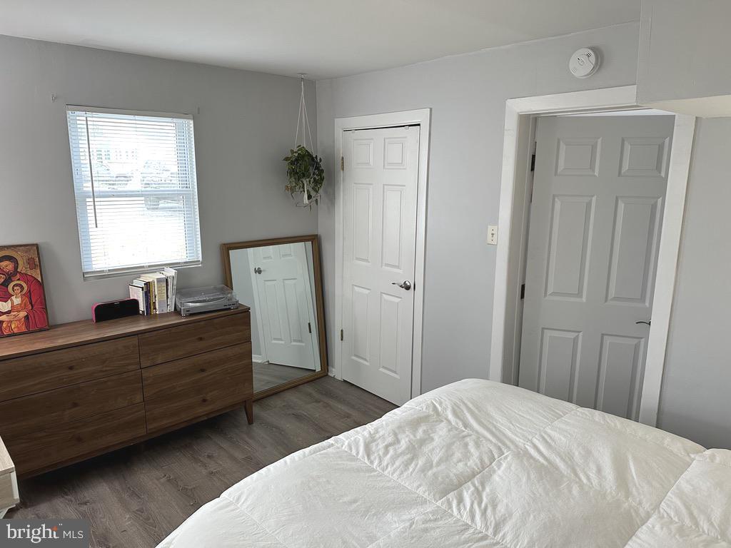 7703 Dover Road Glen Burnie, MD 21060 - Photo 12 of 25 a bed room with a bed and a window
