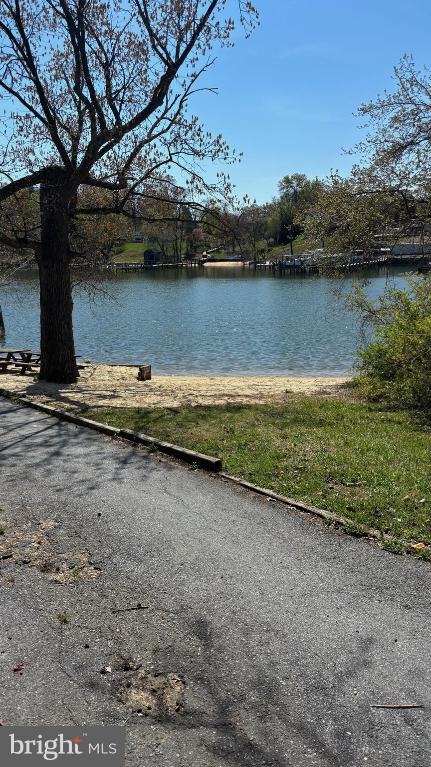7703 Dover Road Glen Burnie, MD 21060 - Photo 20 of 25 a view of a lake with a mountain in the background