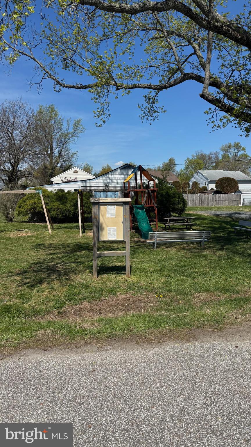 7703 Dover Road Glen Burnie, MD 21060 - Photo 21 of 25 a view of a house with a yard