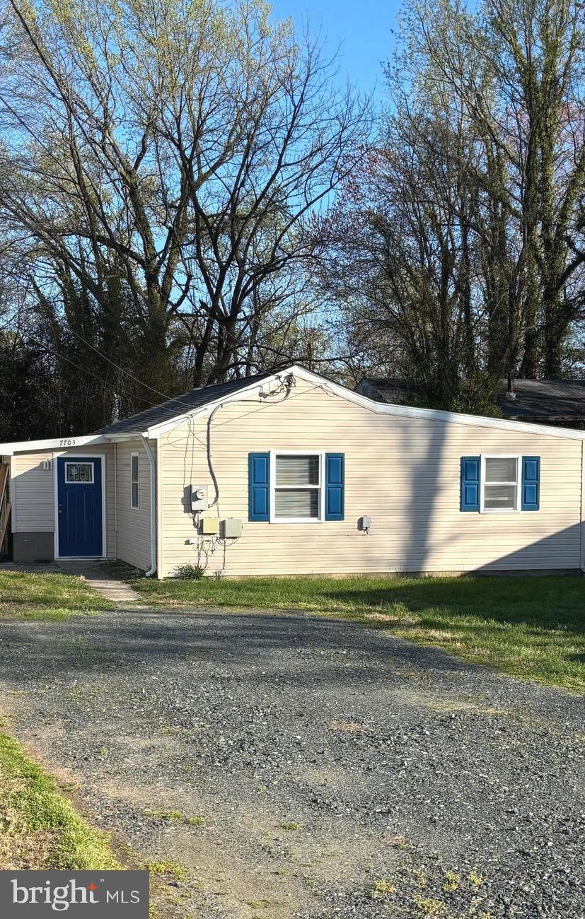 7703 Dover Road Glen Burnie, MD 21060 - Photo 25 of 25 a front view of a house with a yard
