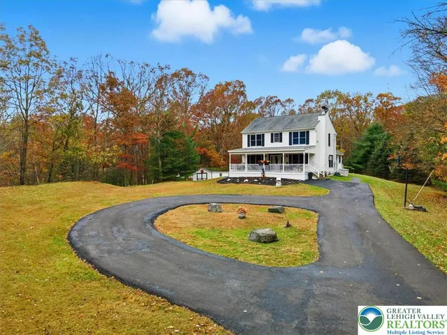 a view of a swimming pool with a yard