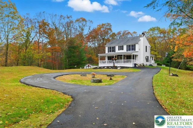 a view of a swimming pool with a house in the background