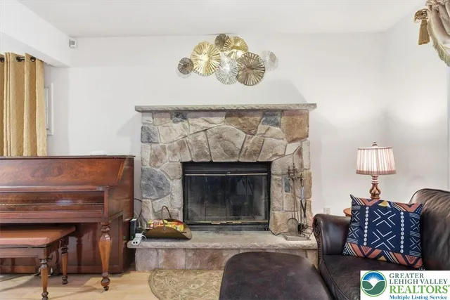a living room with furniture and a fireplace