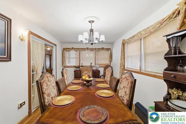 a view of a dining room with furniture window and outside view