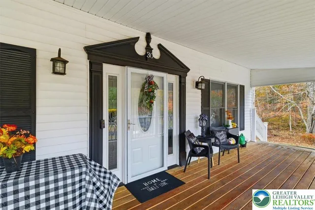 a view of a livingroom with furniture and wooden floor