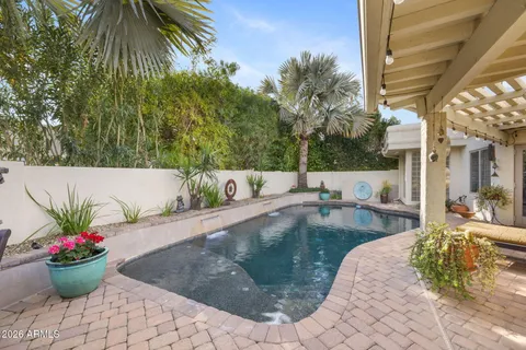 a view of a swimming pool with a lounge chair