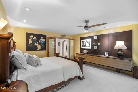a bedroom with a bed and window