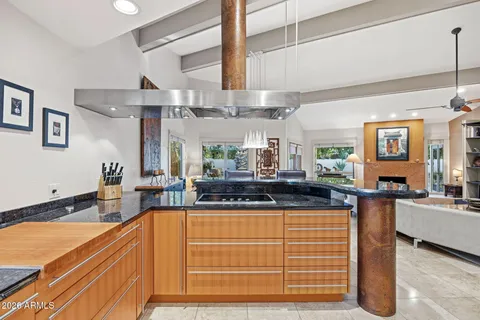a kitchen with stainless steel appliances granite countertop a sink and cabinets