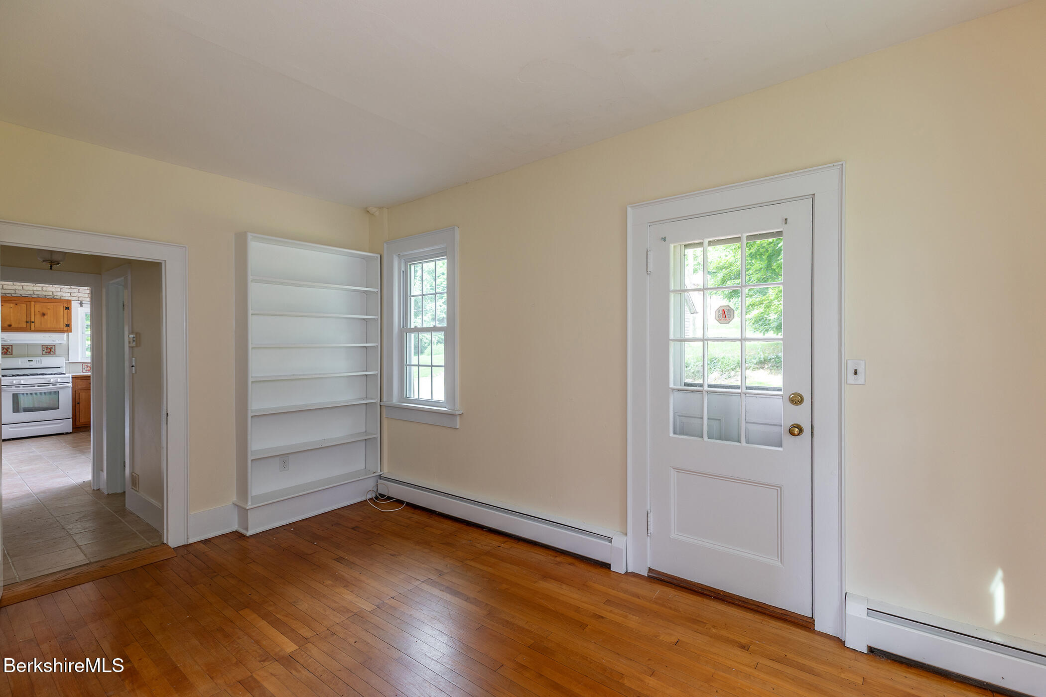 143 White Hollow Road Salisbury, CT 06039 - Photo 11 of 36 an empty room with wooden floor closet and windows