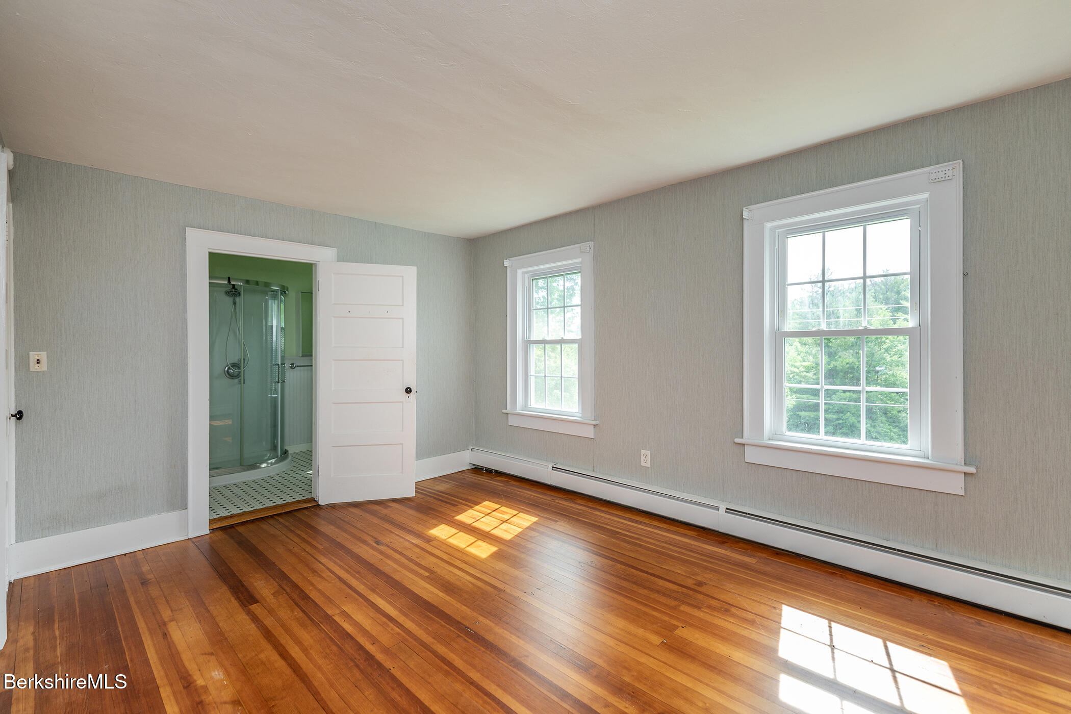 143 White Hollow Road Salisbury, CT 06039 - Photo 14 of 36 a view of empty room with wooden floor and fan