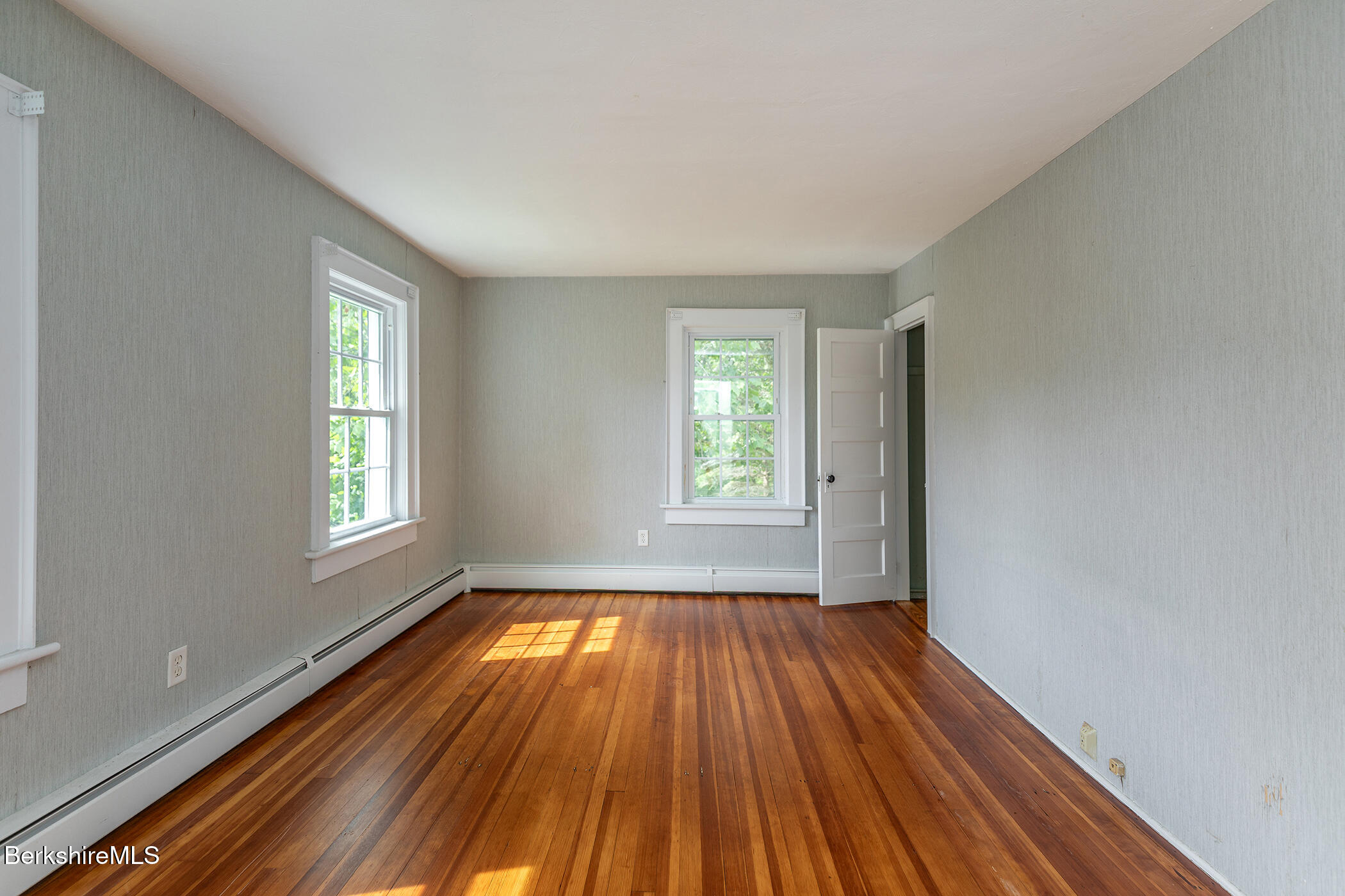 143 White Hollow Road Salisbury, CT 06039 - Photo 15 of 36 a view of an empty room with wooden floor and window