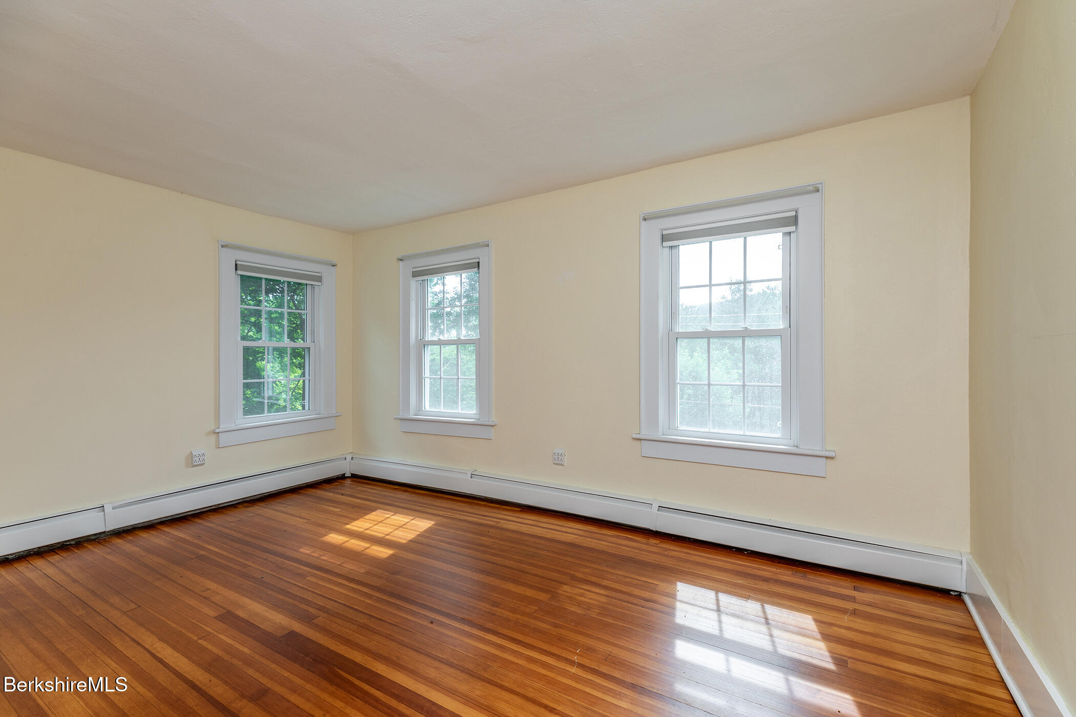 143 White Hollow Road Salisbury, CT 06039 - Photo 20 of 36 a view of empty room with wooden floor and fan