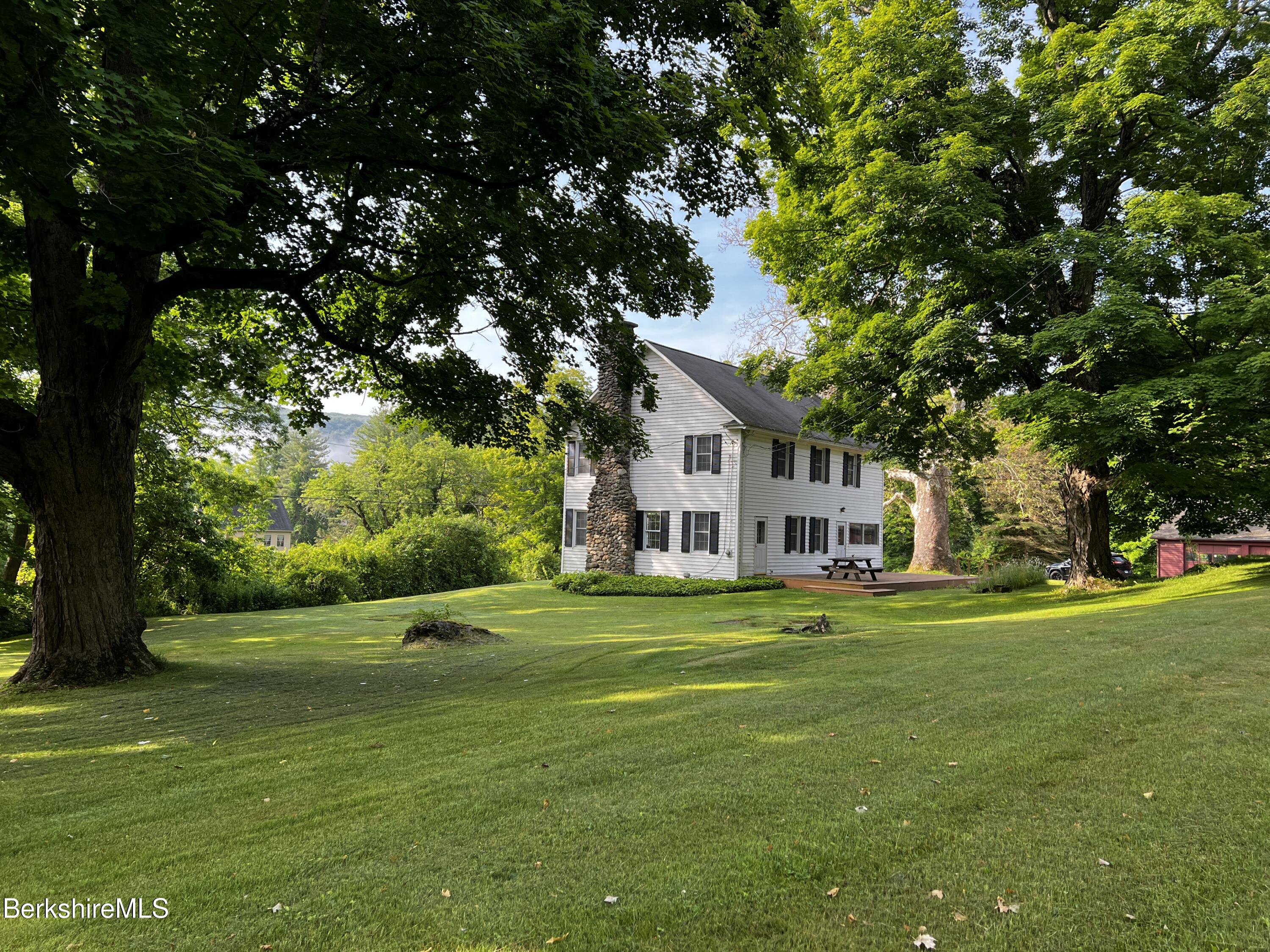 143 White Hollow Road Salisbury, CT 06039 - Photo 23 of 36 a front view of a house with a yard