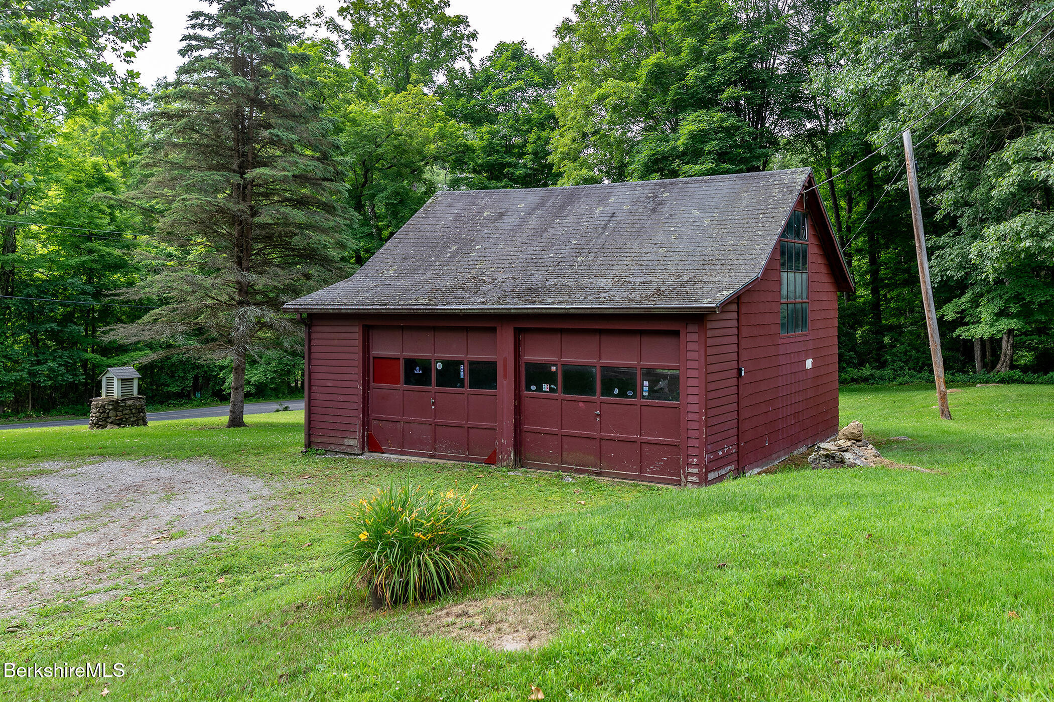 143 White Hollow Road Salisbury, CT 06039 - Photo 29 of 36 a view of a backyard with barn and large trees