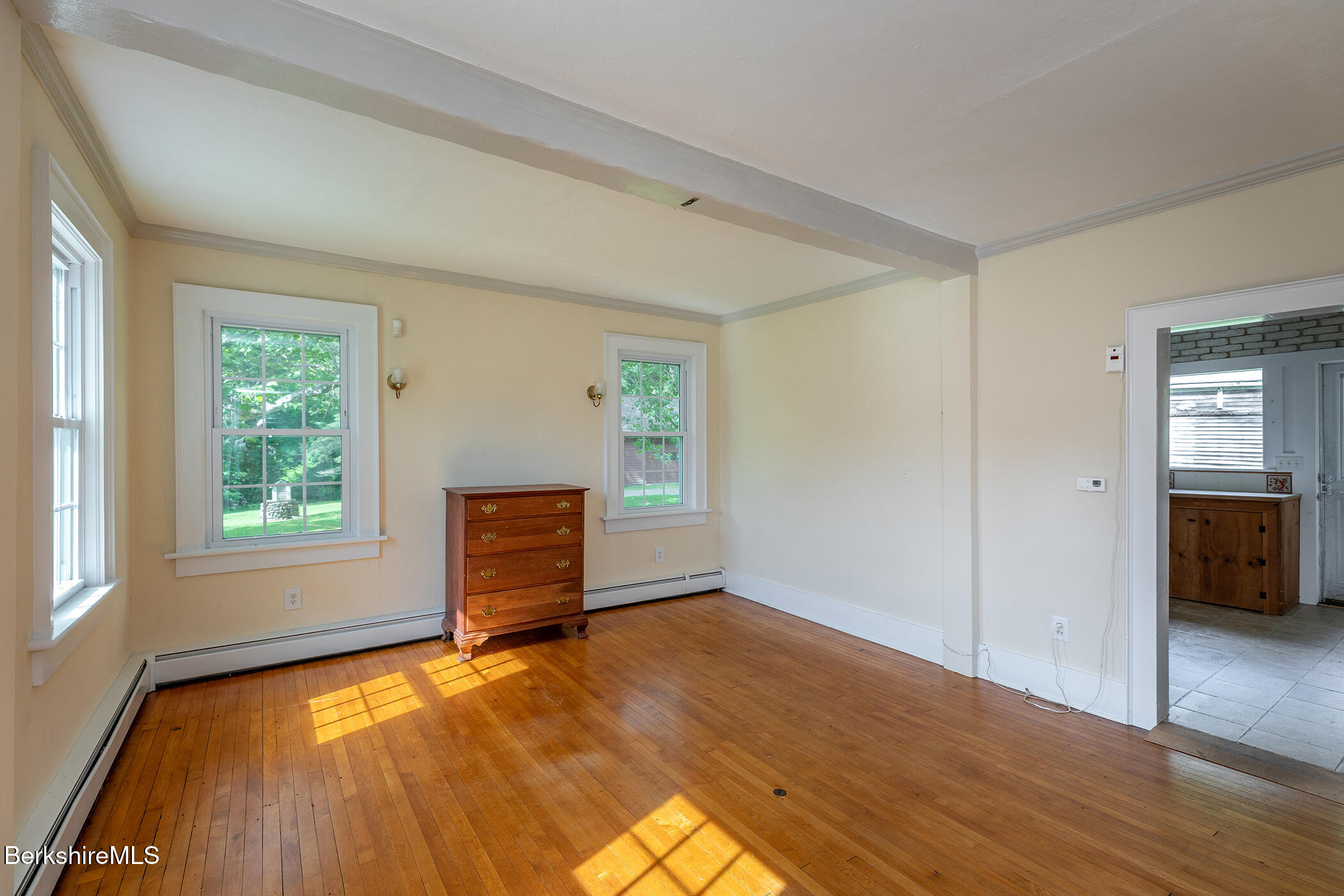 143 White Hollow Road Salisbury, CT 06039 - Photo 6 of 36 an empty room with wooden floor and windows