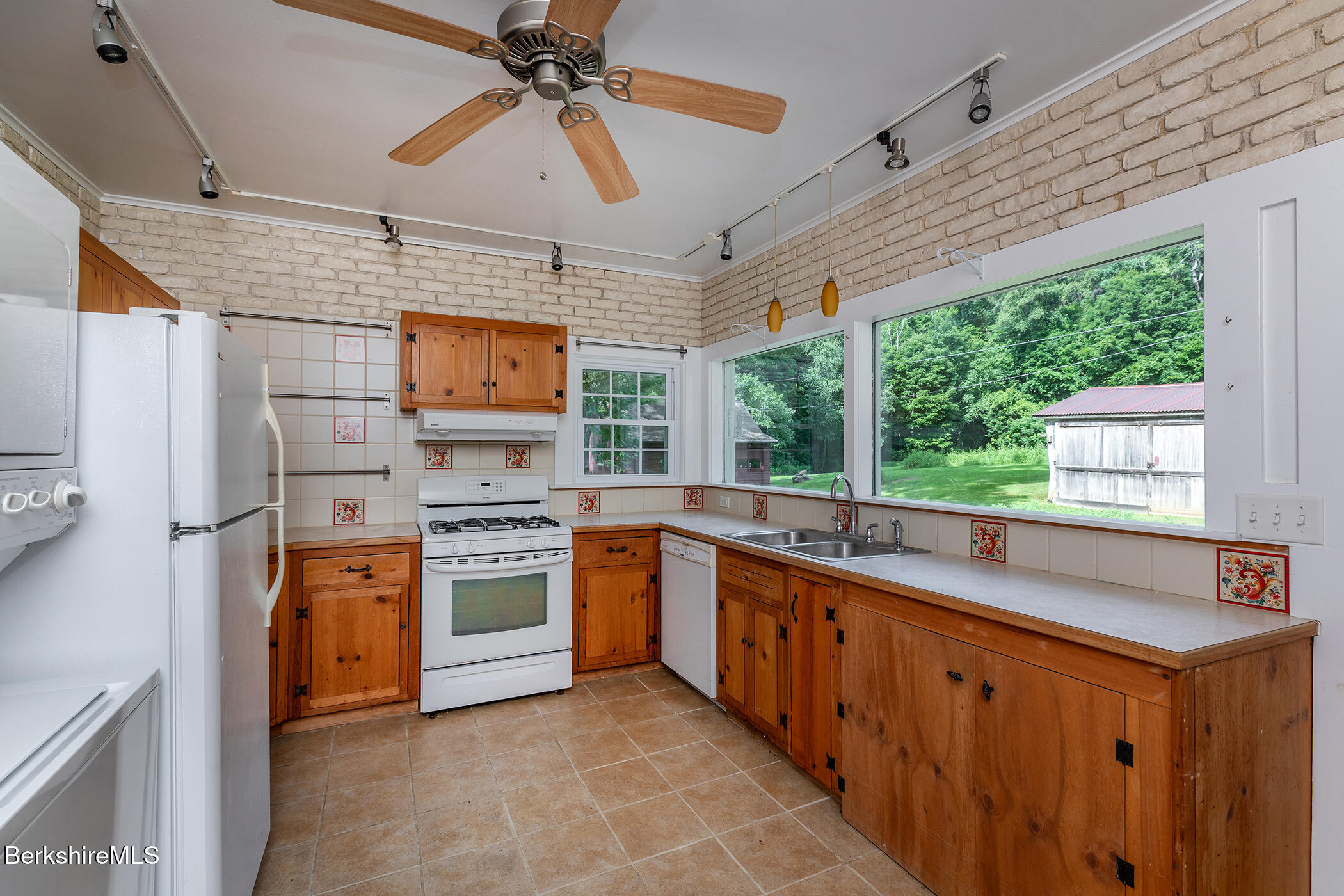 143 White Hollow Road Salisbury, CT 06039 - Photo 8 of 36 a kitchen with stainless steel appliances granite countertop a stove and a sink