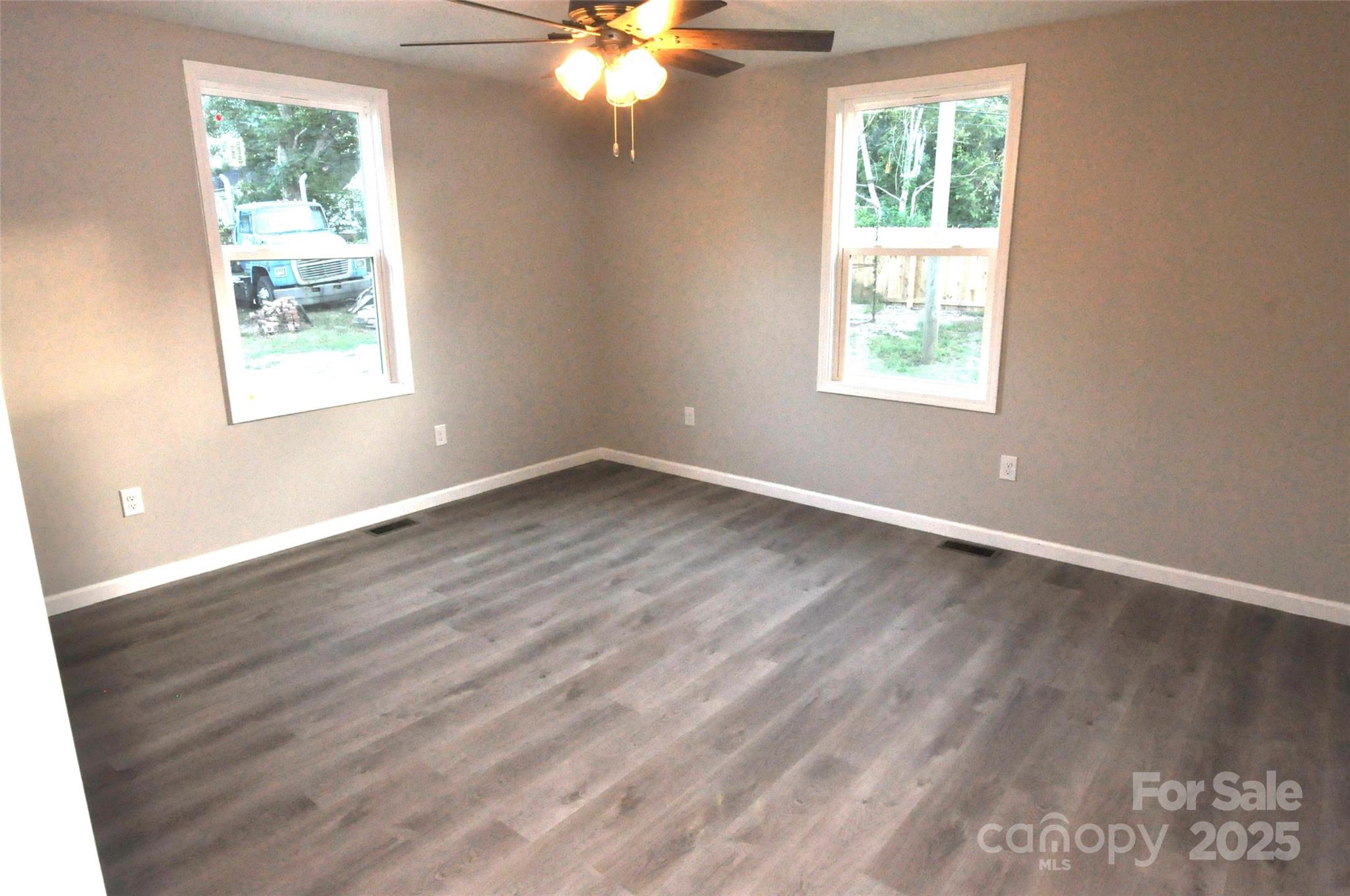 538 2nd Street Chester, SC 29706 - Photo 16 of 17 an empty room with wooden floor and windows