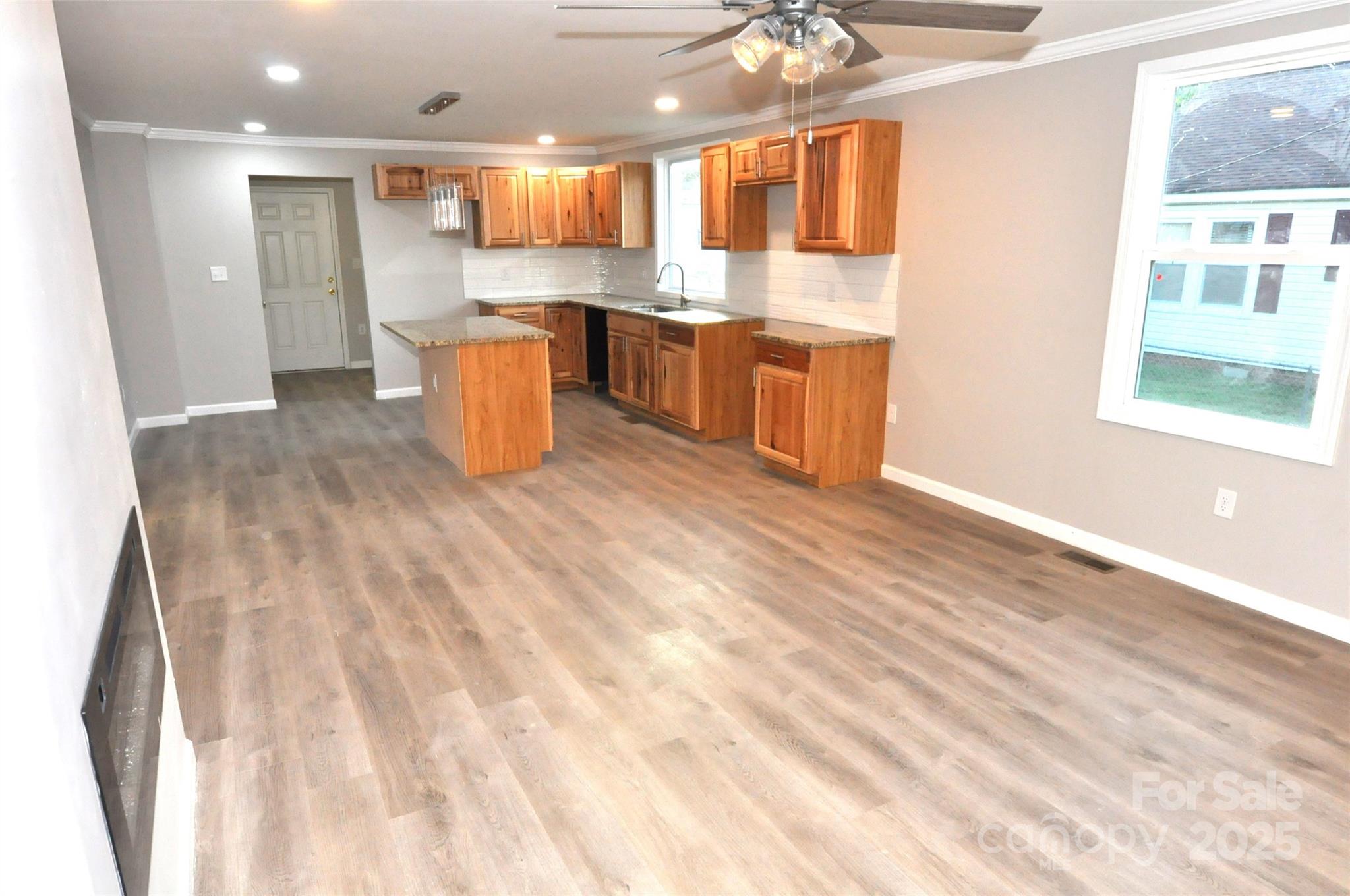 538 2nd Street Chester, SC 29706 - Photo 3 of 17 a kitchen with stainless steel appliances granite countertop a sink and a stove