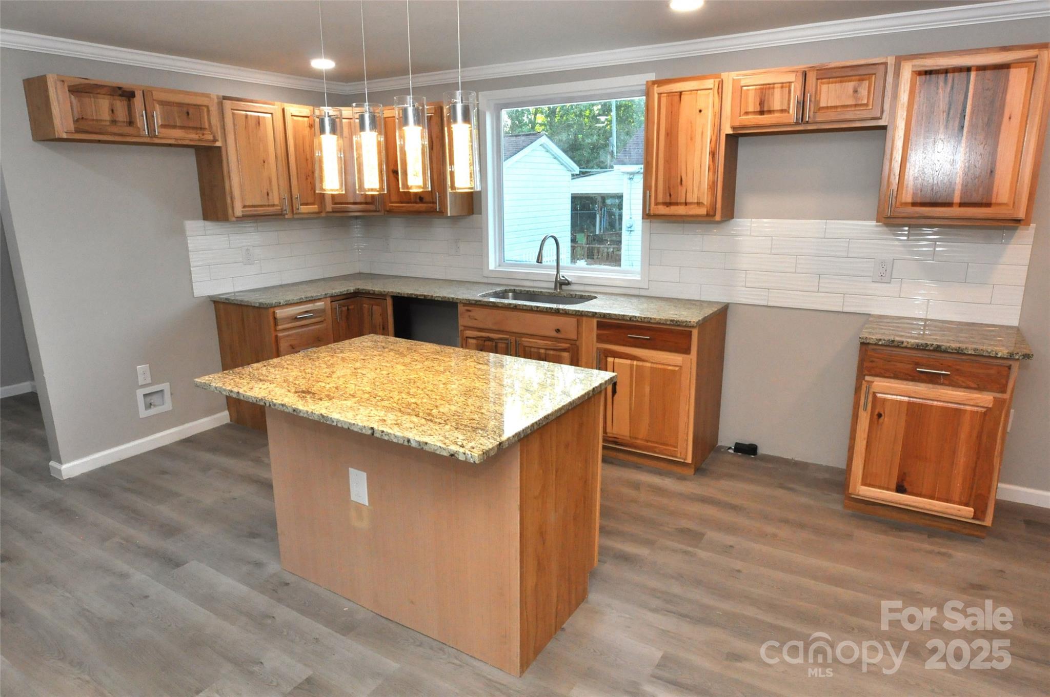 538 2nd Street Chester, SC 29706 - Photo 8 of 17 a kitchen with stainless steel appliances granite countertop a sink counter space cabinets and a window