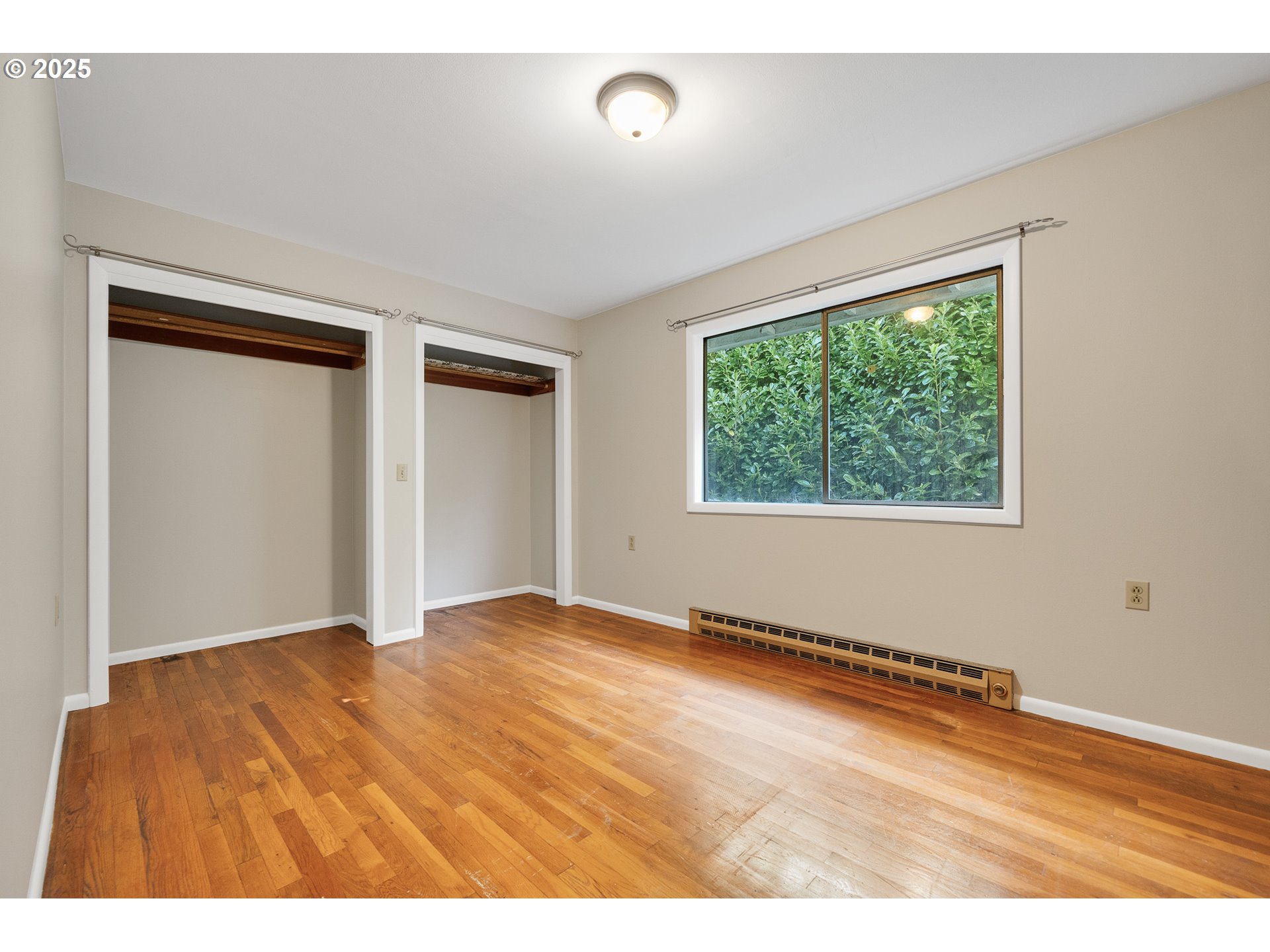 1806 8th Street Tillamook, OR 97141 - Photo 11 of 31 a view of an empty room with wooden floor and a window