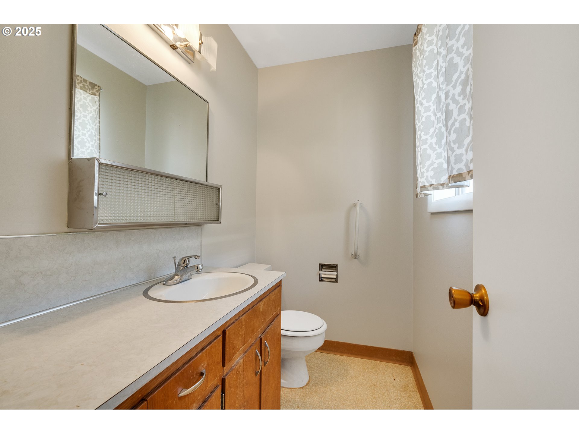 1806 8th Street Tillamook, OR 97141 - Photo 15 of 31 a bathroom with a sink toilet and shower