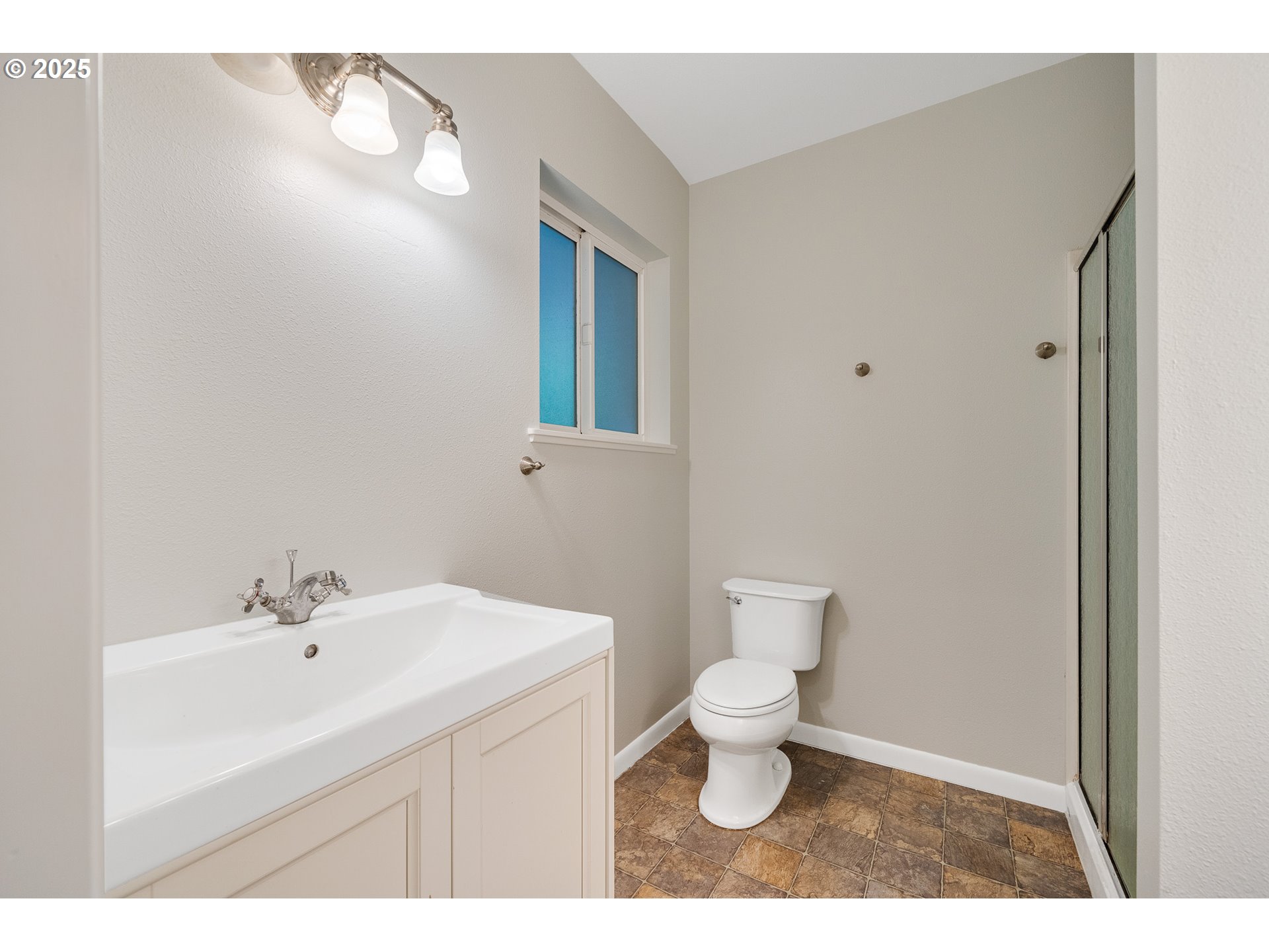 1806 8th Street Tillamook, OR 97141 - Photo 20 of 31 a bathroom with a sink toilet and a mirror