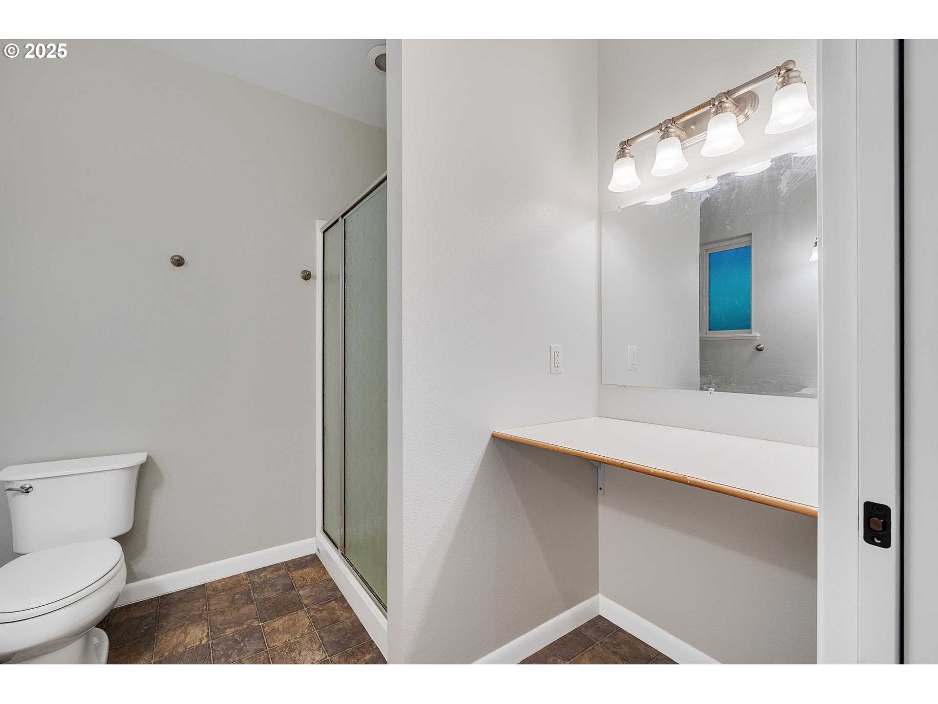 1806 8th Street Tillamook, OR 97141 - Photo 21 of 31 a bathroom with a toilet sink and mirror