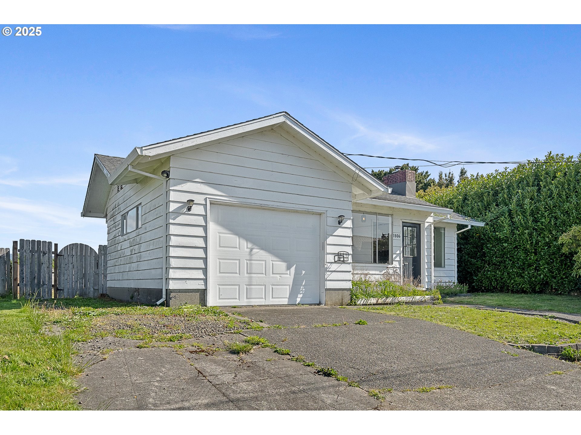 1806 8th Street Tillamook, OR 97141 - Photo 25 of 31 a view of a backyard of the house