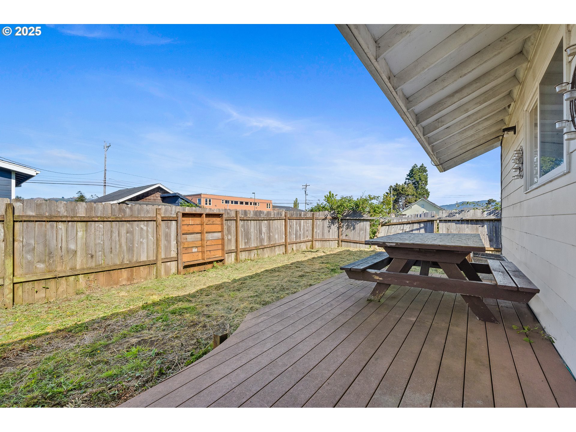 1806 8th Street Tillamook, OR 97141 - Photo 29 of 31 a view of a backyard with sitting area