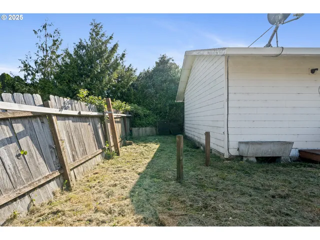 a backyard of a house with lots of green space