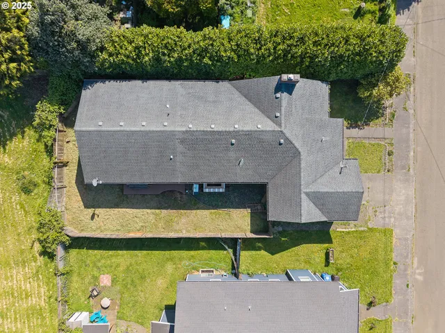 an aerial view of a house with a swimming pool