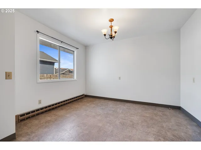 an empty room with a cabinet