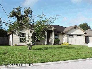 1310 Rushing Drive Orange Park, FL 32065 - Photo 1 of 1 a front view of a house with a yard