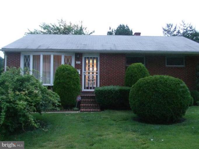 1818 Willann Road Rosedale, MD 21237 - Photo 1 of 25 a front view of a house with a garden