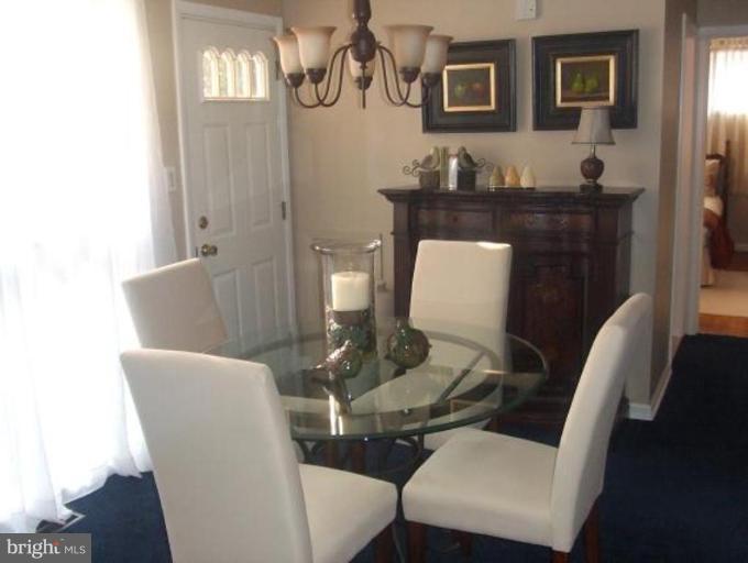 1818 Willann Road Rosedale, MD 21237 - Photo 14 of 25 a view of a dining room with furniture and wooden floor