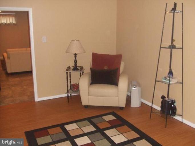 1818 Willann Road Rosedale, MD 21237 - Photo 18 of 25 a living room with a couch and a table