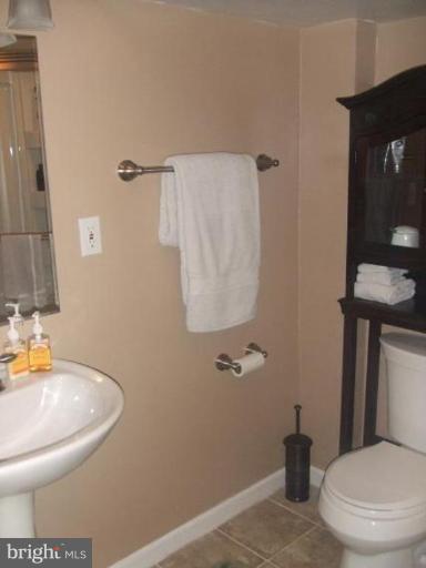 1818 Willann Road Rosedale, MD 21237 - Photo 19 of 25 a bathroom with a toilet and a sink