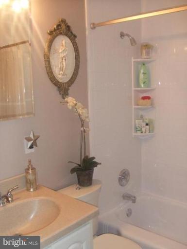 1818 Willann Road Rosedale, MD 21237 - Photo 10 of 25 a bathroom with a sink and a mirror