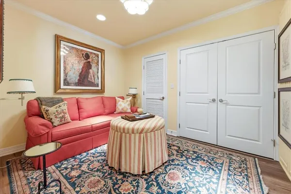 a living room with furniture and a rug
