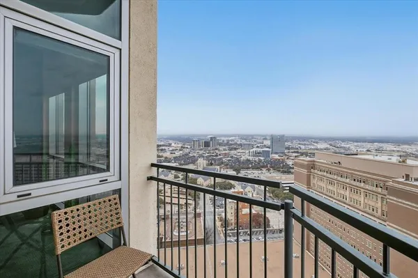 a view of a balcony with city
