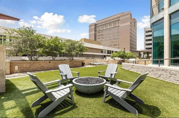 a view of swimming pool with outdoor seating