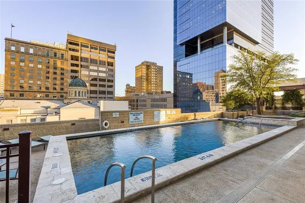a view of swimming pool with outdoor seating