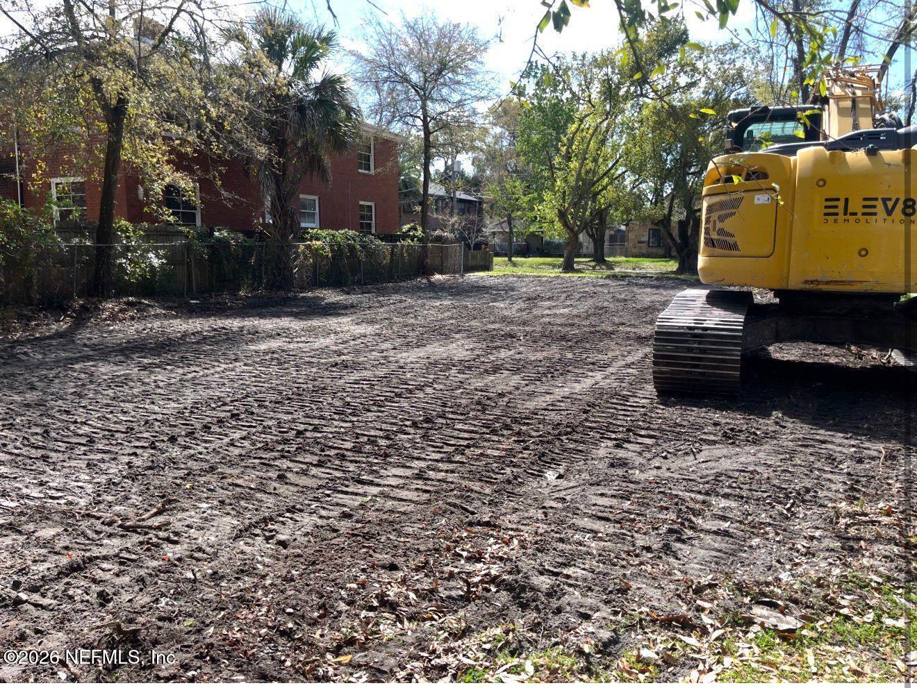 a backyard of a house with barbeque oven