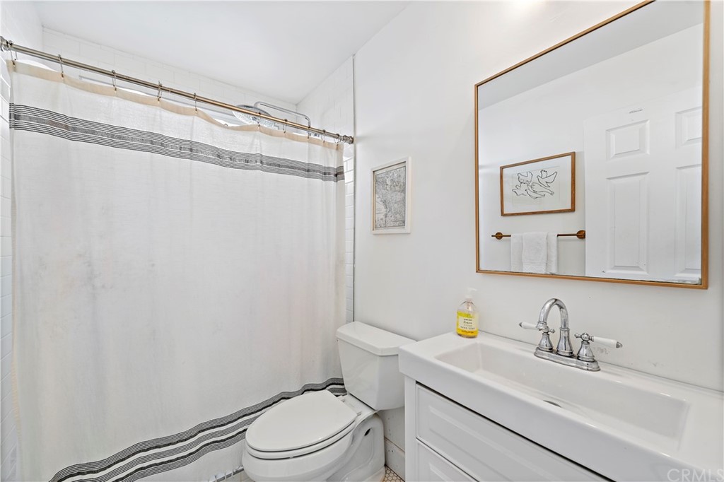 2899 Riachuelo San Clemente, CA 92673 - Photo 15 of 22 a bathroom with a sink a toilet and shower
