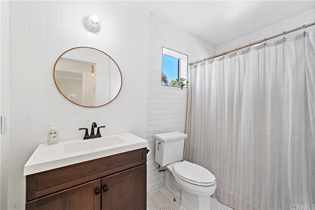 2899 Riachuelo San Clemente, CA 92673 - Photo 18 of 22 a bathroom with a toilet a sink and a mirror