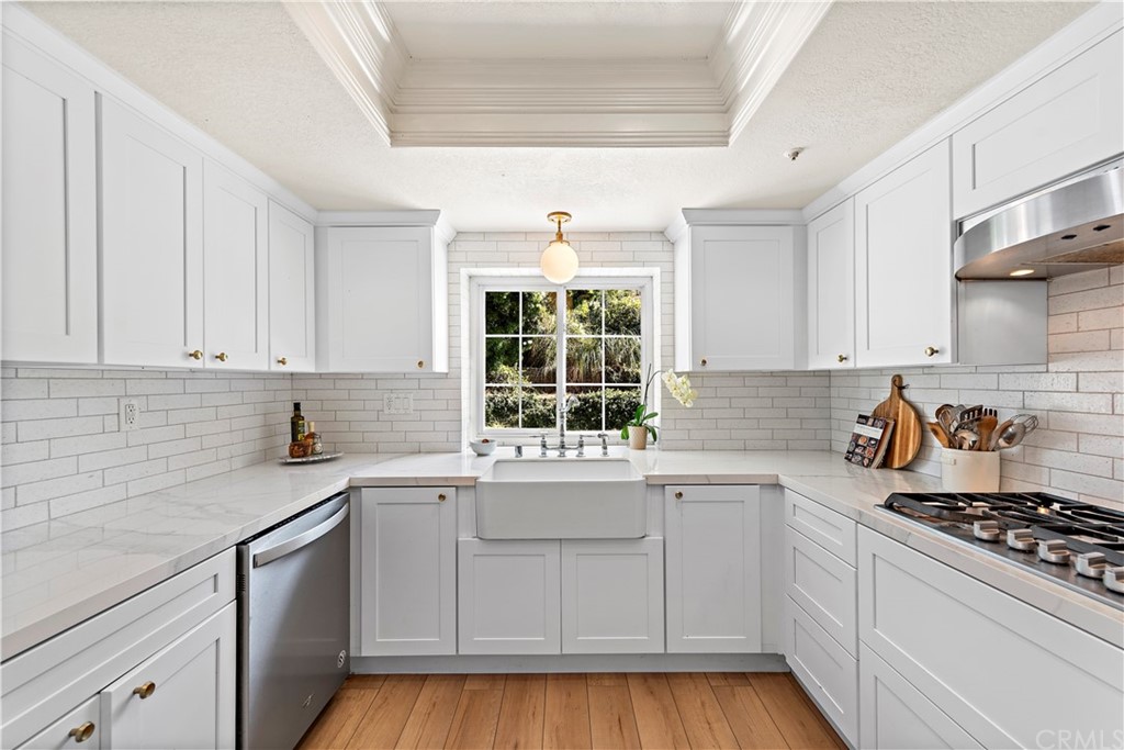 2899 Riachuelo San Clemente, CA 92673 - Photo 9 of 22 a kitchen with a sink stove and cabinets